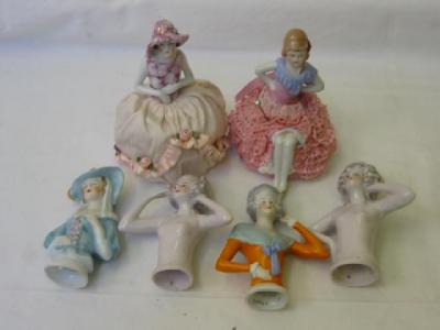 Appraisal: A pair of porcelain pin cushion dolls modelled with nude