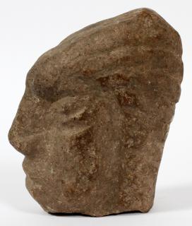 Appraisal: STONE CARVED HEAD STONE CARVED HEAD H Stylized profile