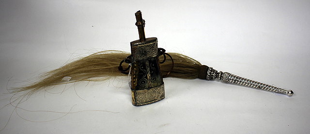 Appraisal: A WHITE METAL MOUNTED HORSE HAIR WHIP the handle with