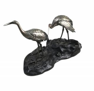 Appraisal: Mixed Metal Sculpture Cranes on a Rock Mixed metal sculpture