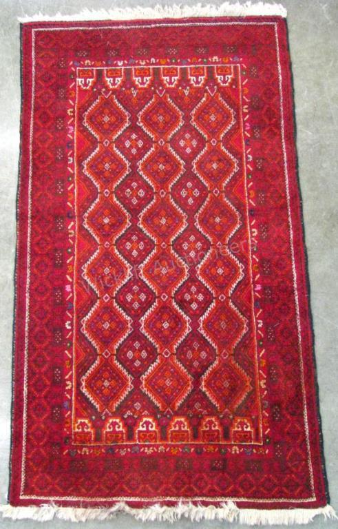 Appraisal: Handmade Oriental Area Rug traditional repeating design red field with