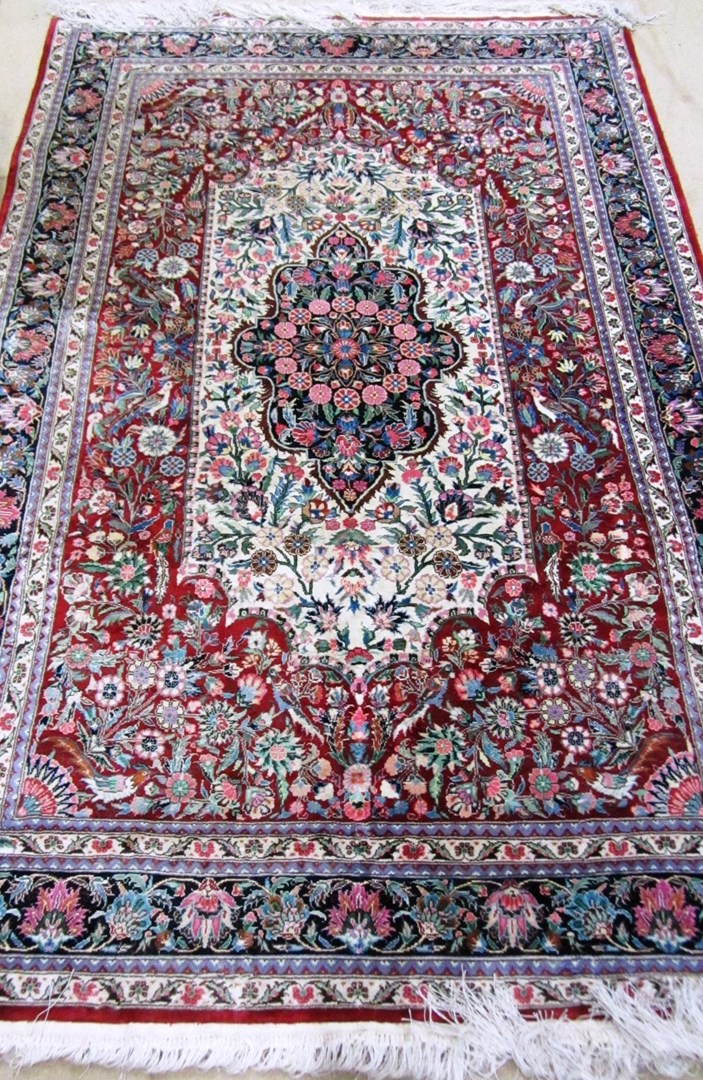 Appraisal: A silk Esfahan rug the madder filed with an ivory