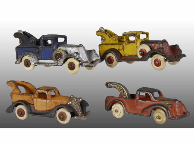 Appraisal: Lot of Cast Iron Tow Truck Toys Description One Arcade