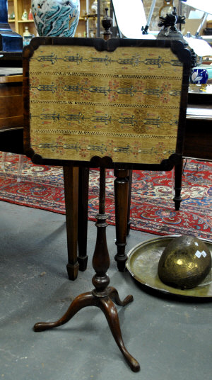 Appraisal: A th century mahogany pole screen the adjustable screen with