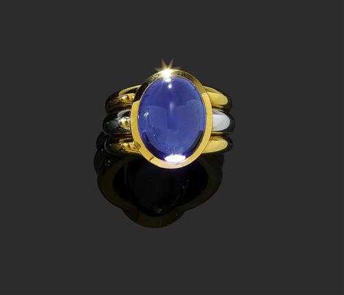 Appraisal: TANZANITE AND GOLD RING P CLARD White and yellow gold