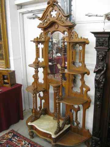 Appraisal: Victorian Carved Walnut Etagere marble near base with drawer below