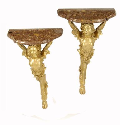 Appraisal: A pair of continental giltwood and gesso console tables with