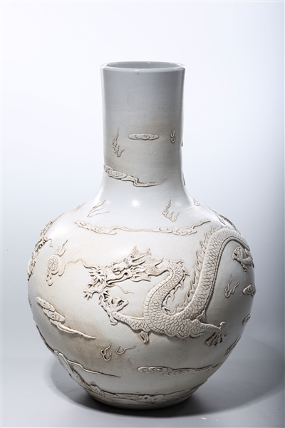 Appraisal: Chinese white glazed porcelain globular vase depicting dragons chasing pearls