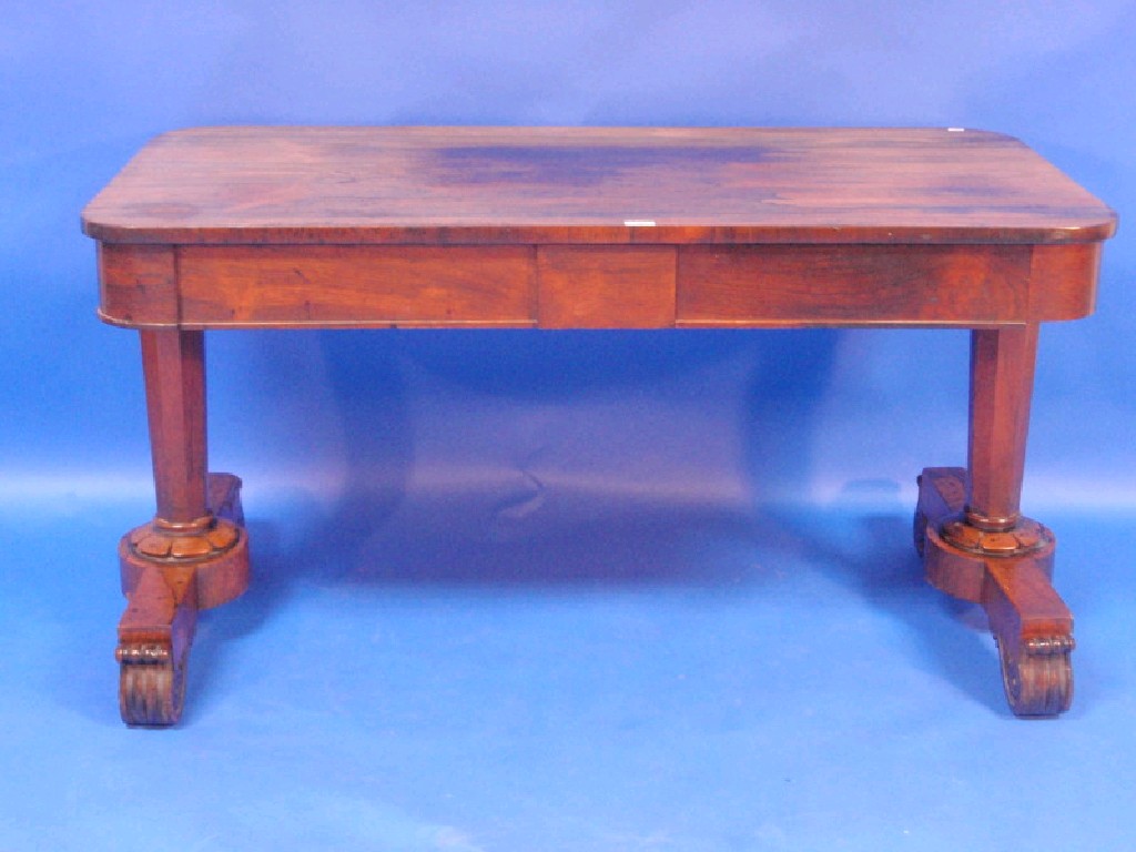 Appraisal: A late Regency rosewood rectangular library table fitted with two