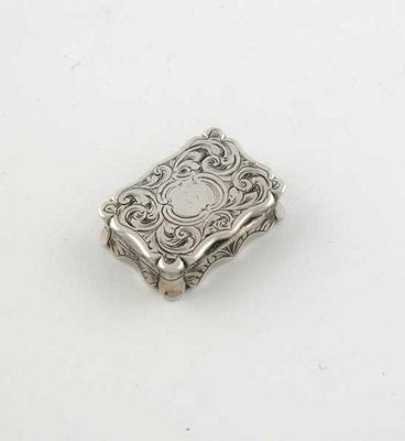 Appraisal: A Victorian small engraved vinaigrette of shaped oblong outline by