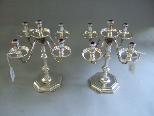 Appraisal: A pair of silver five light small candelabra with circular