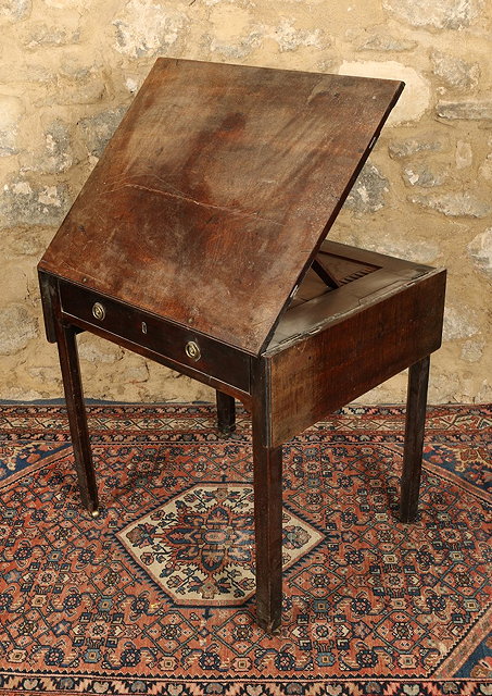 Appraisal: A LATE GEORGIAN MAHOGANY WRITING OR ARTIST'S TABLE the adjustable