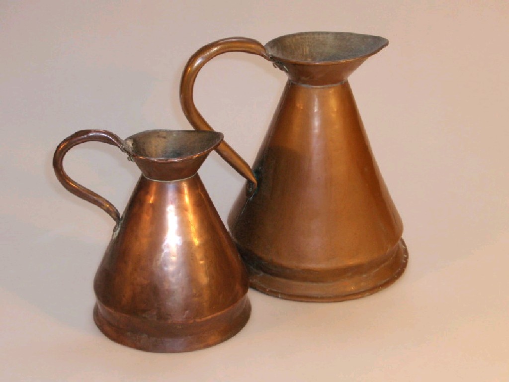 Appraisal: Two copper measuring jugs for one and a half gallon