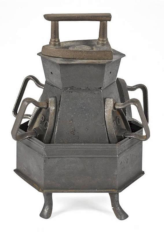 Appraisal: Tin sad iron heater together with five cast iron Tin