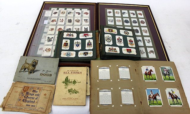 Appraisal: TWO ALBUMS OF CIGARETTE CARDS two framed sets and some