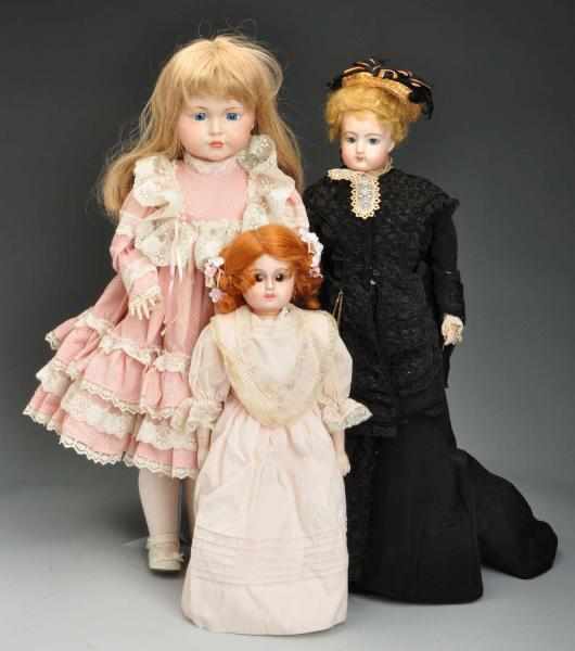 Appraisal: Lot of Reproduction Dolls with Bisque Heads Description F Gaultier