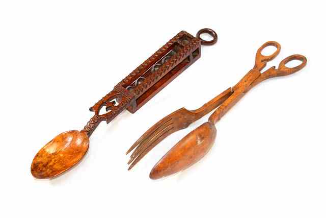 Appraisal: A WELSH CARVED WOODEN LOVE SPOON handle inset four spheres