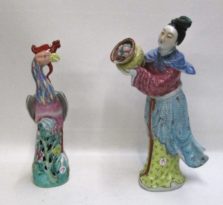 Appraisal: TWO CHINESE PORCELAIN FIGURES Famille Rose a standing woman holding