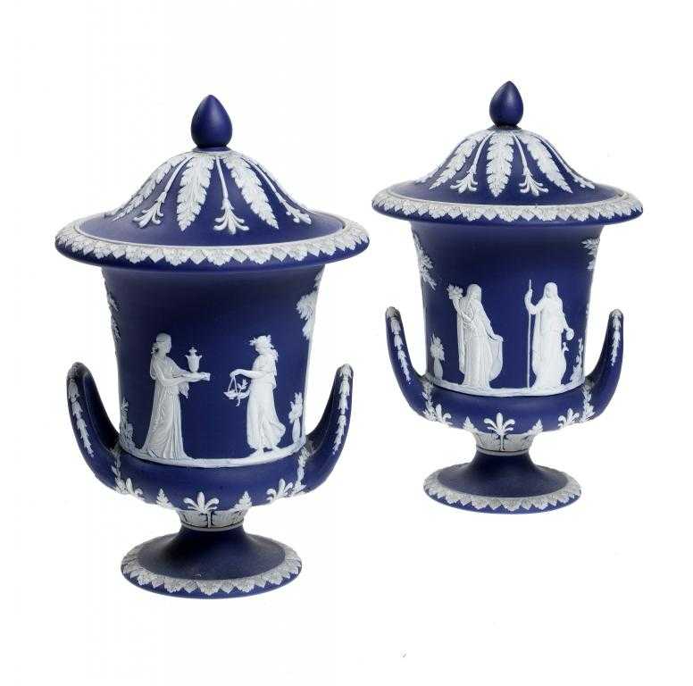 Appraisal: A PAIR OF WEDGWOOD JASPER WARE VASES AND COVERS of