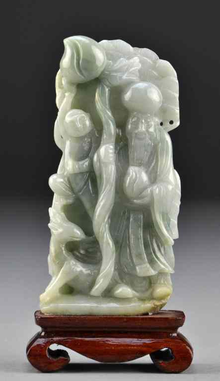 Appraisal: Chinese Carved Jade SculptureFinely carved to depict a scholar holding