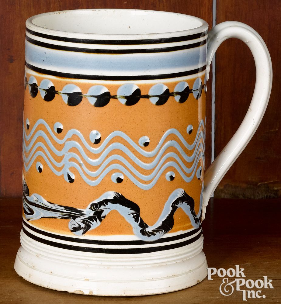 Appraisal: Mocha mug Mocha mug with cat's-eye wavy line and earthworm