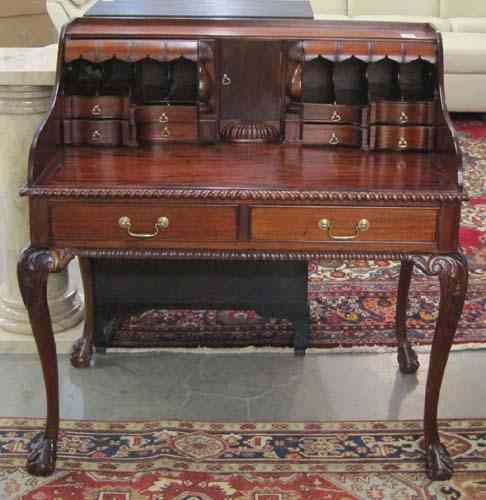 Appraisal: CLASSIC CHIPPENDALE STYLE MAHOGANY WRITING DESK the rectangular top surmounted