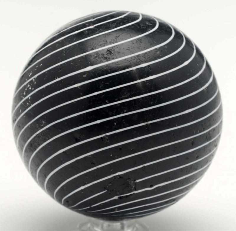 Appraisal: Large Black Clambroth Marble Black opaque base with evenly spaced