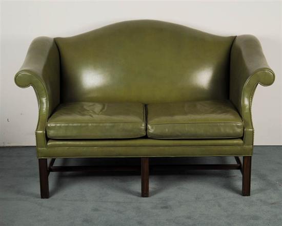 Appraisal: A Chippendale-style Settee having a camel back rolled arms mahogany