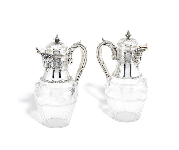 Appraisal: A pair of French silver mounted glass claret jugs by