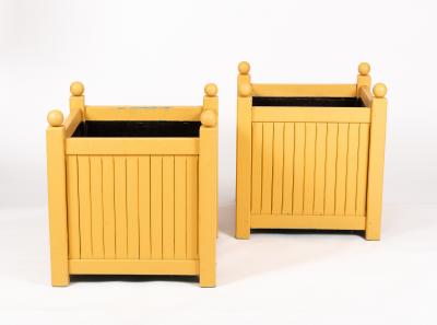 Appraisal: A pair of ochre painted wooden square planters with ball