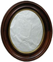 Appraisal: An Antique Walnut Mirror A deep oval walnut frame with