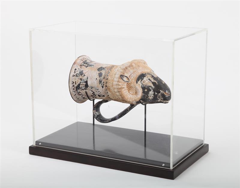 Appraisal: APULIAN STYLE RED-FIGURED RHYTON Modeled as a ram's head in