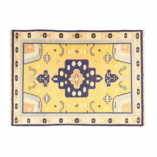 Appraisal: FLAT WEAVE RUG Yellow-orange field indigo cruciform medallion mutlicolor spandrels