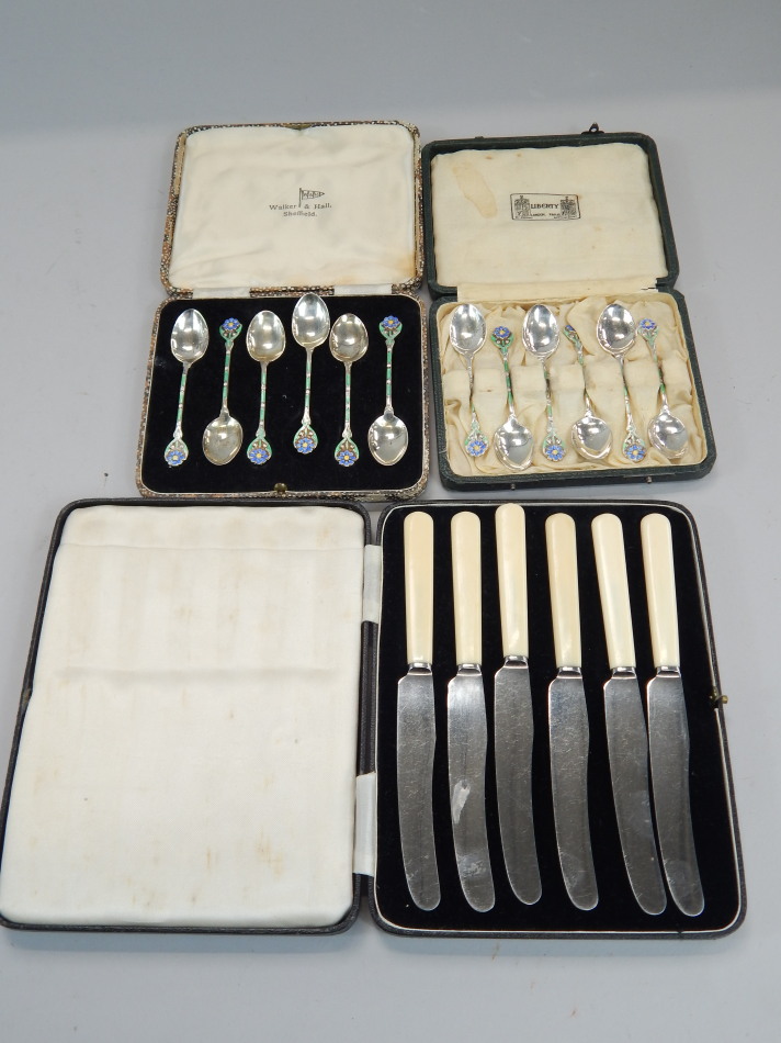 Appraisal: Two sets of six associated silver and enamel coffee spoons