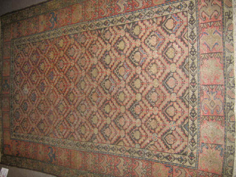 Appraisal: MALAYIR THROW RUG The tan field shows an allover pattern