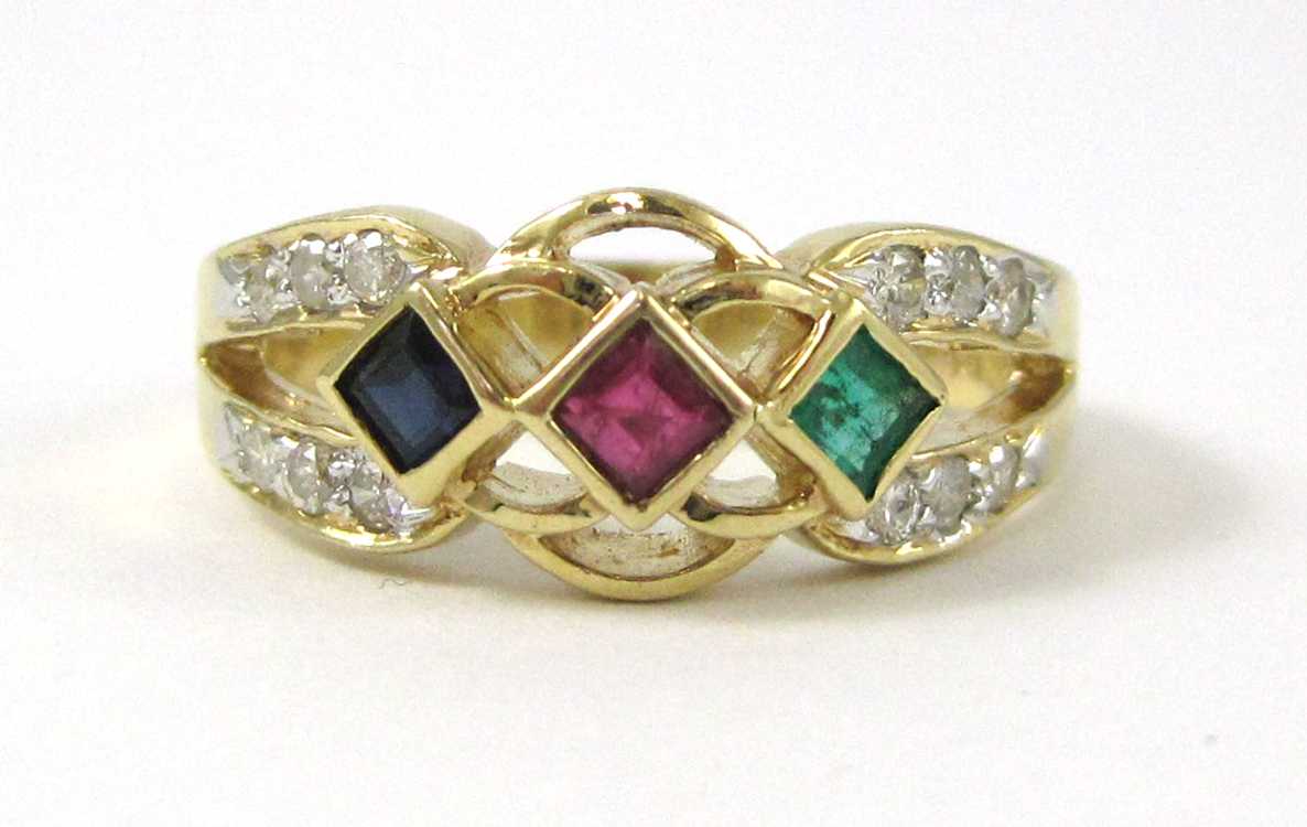 Appraisal: RUBY SAPPHIRE EMERALD AND DIAMOND RING The k gold ring