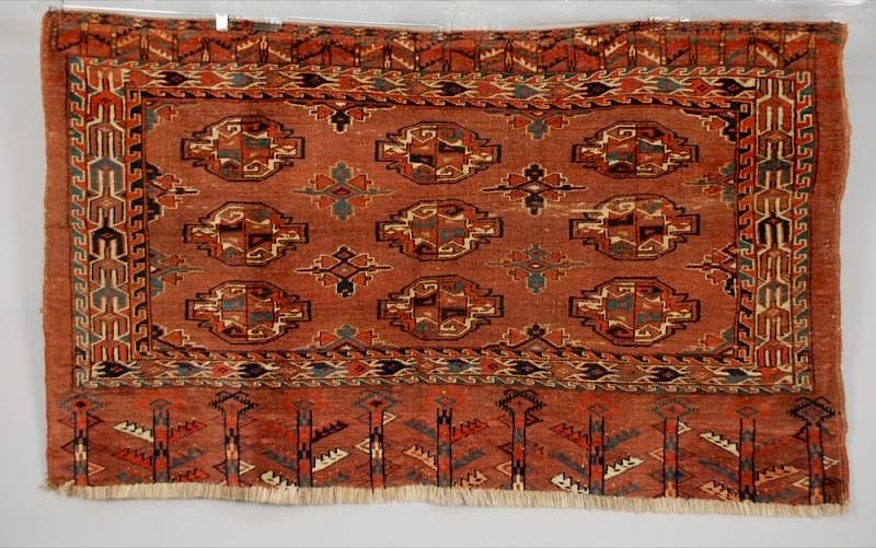 Appraisal: TURKMEN CARPET EARLY th C Aubergine palette in nine gul