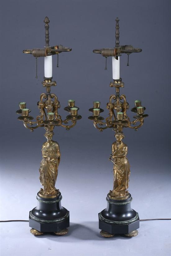 Appraisal: PAIR EMPIRE-STYLE BRONZE-DOR FIGURAL FIVE-LIGHT CANDELABRA th century Shaped black