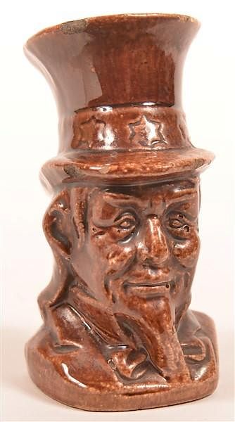 Appraisal: Brown Glazed Earthenware Uncle Sam Still Bank Brown Glazed Earthenware