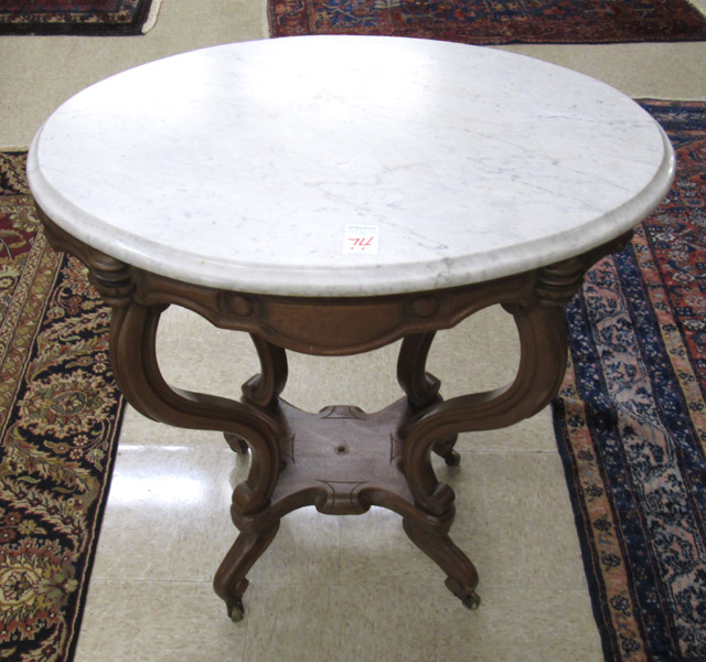 Appraisal: VICTORIAN MARBLE-TOP LAMP TABLE Rococo Revival design American c having