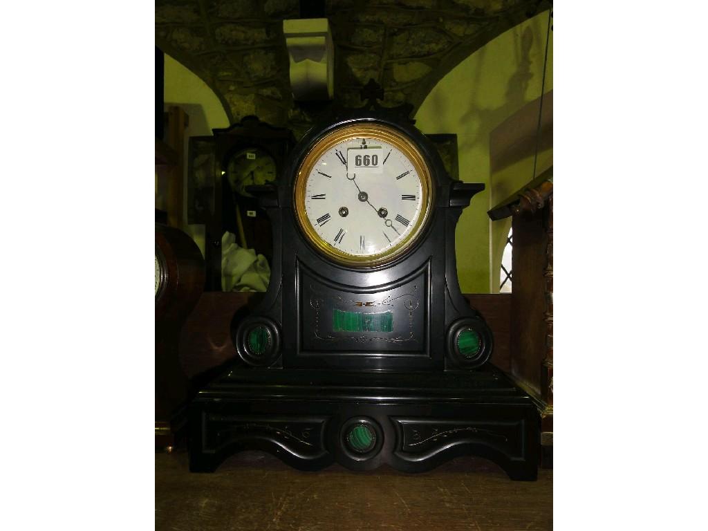 Appraisal: A late Victorian black slate mantle clock with two train