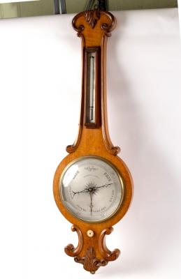 Appraisal: A Regency oak wheel barometer with thermometer by Negretti Zambra