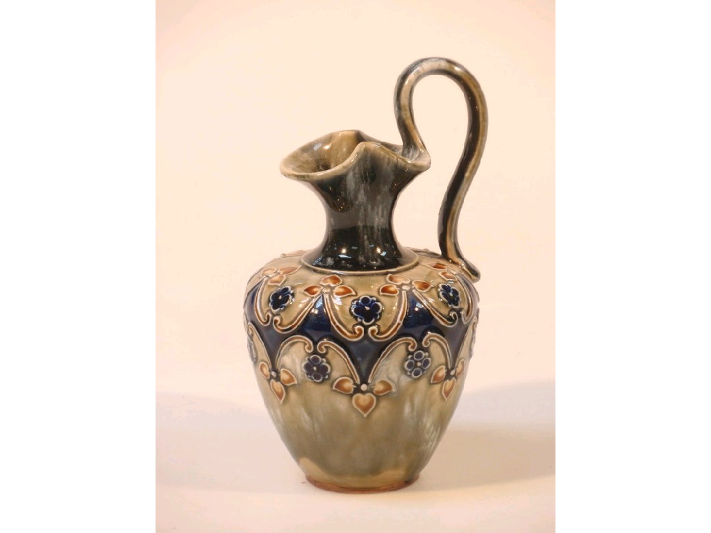 Appraisal: A Royal Doulton stoneware ewer decorated with flower heads and