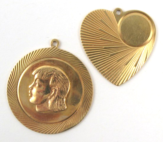 Appraisal: TWO FOURTEEN KARAT GOLD CHARMS one round with a portrait