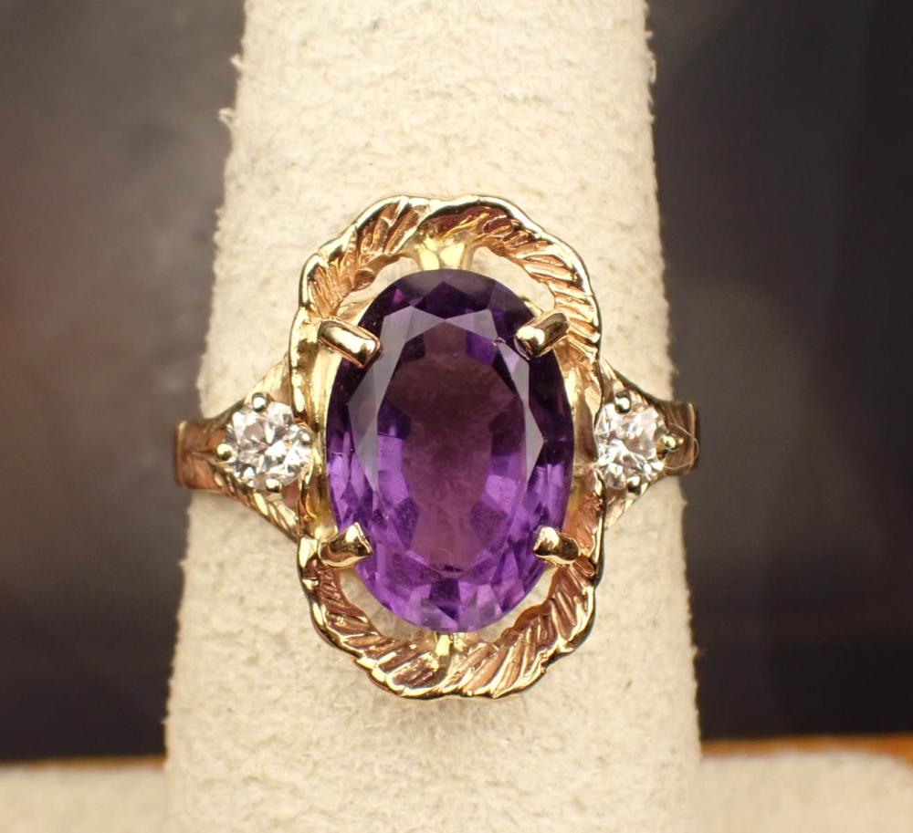 Appraisal: AMETHYST DIAMOND AND FOURTEEN KARAT GOLD RING The yellow gold