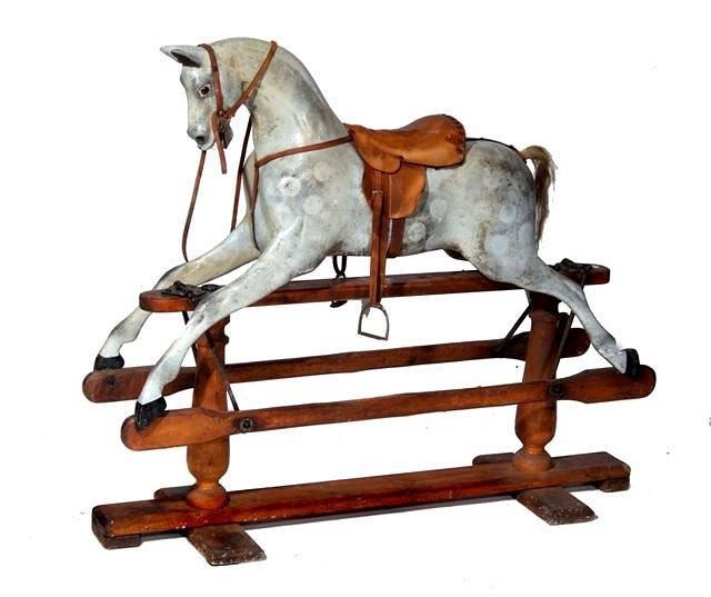 Appraisal: AN EARLY TH CENTURY DAPPLE GREY ROCKING HORSE probably by