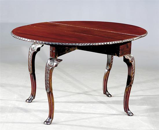 Appraisal: George III carved mahogany drop-leaf table circa oval top with