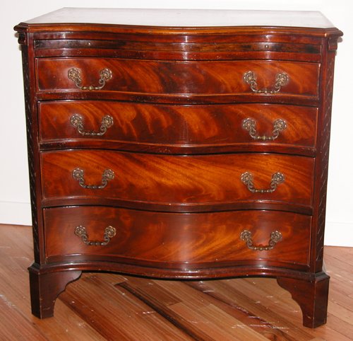 Appraisal: Artist Title Serpentine front mahogany Chippendale style chest with pull