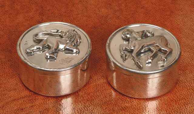 Appraisal: A PAIR OF SILVER CIRCULAR BOXES with press on lids