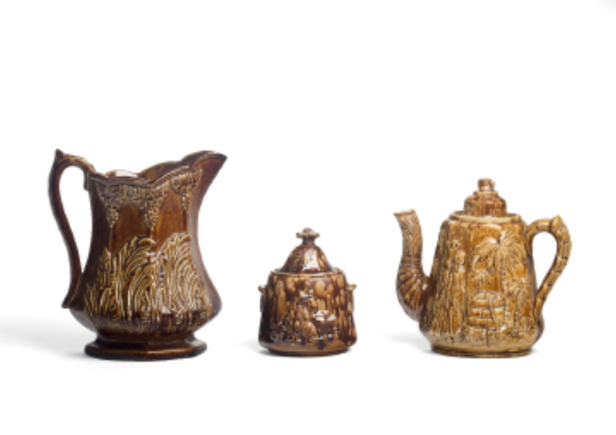 Appraisal: THREE AMERICAN OR ENGLISH BROWN-GLAZED POTTERY WARES MID-LATE NINETEENTH CENTURY